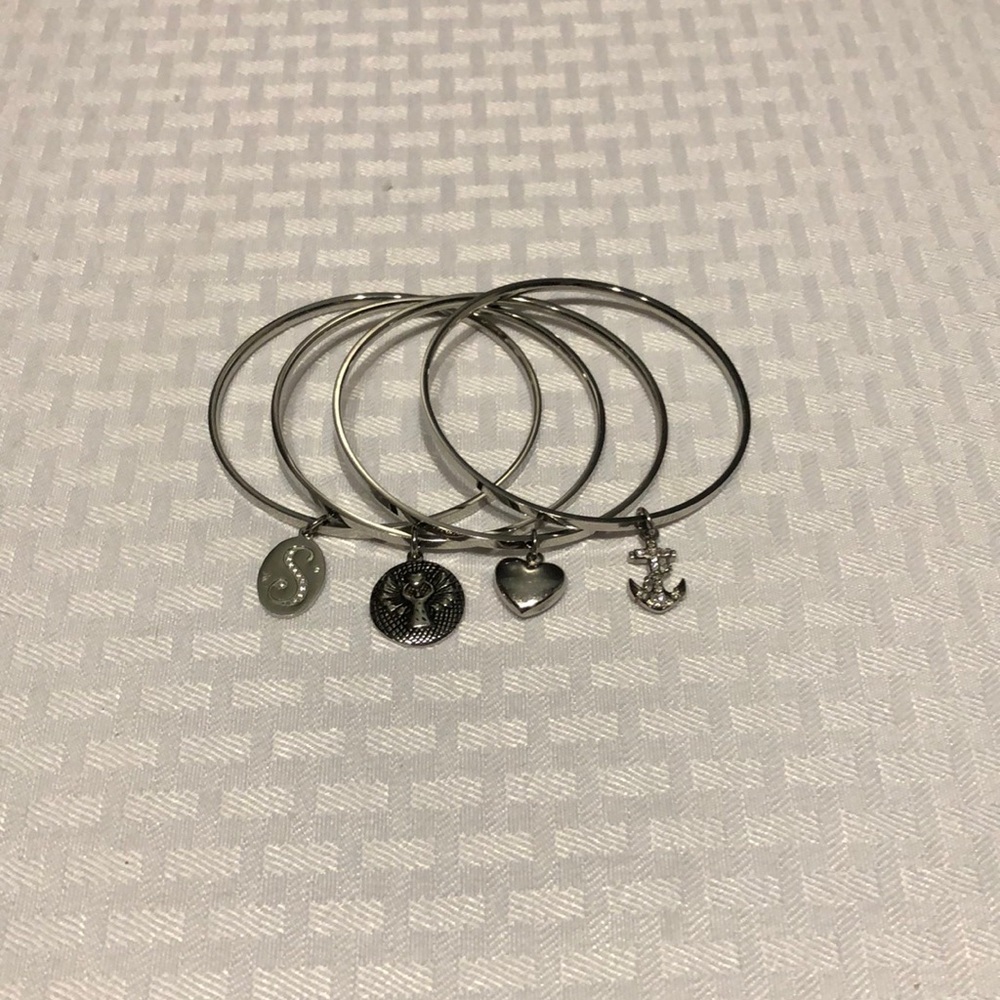 Lady’s silver bangles with charms
